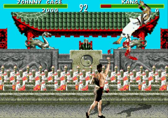 Mortal Kombat - Genesis version image featuring Johnny Cage killing Kano in a spray of blood. 